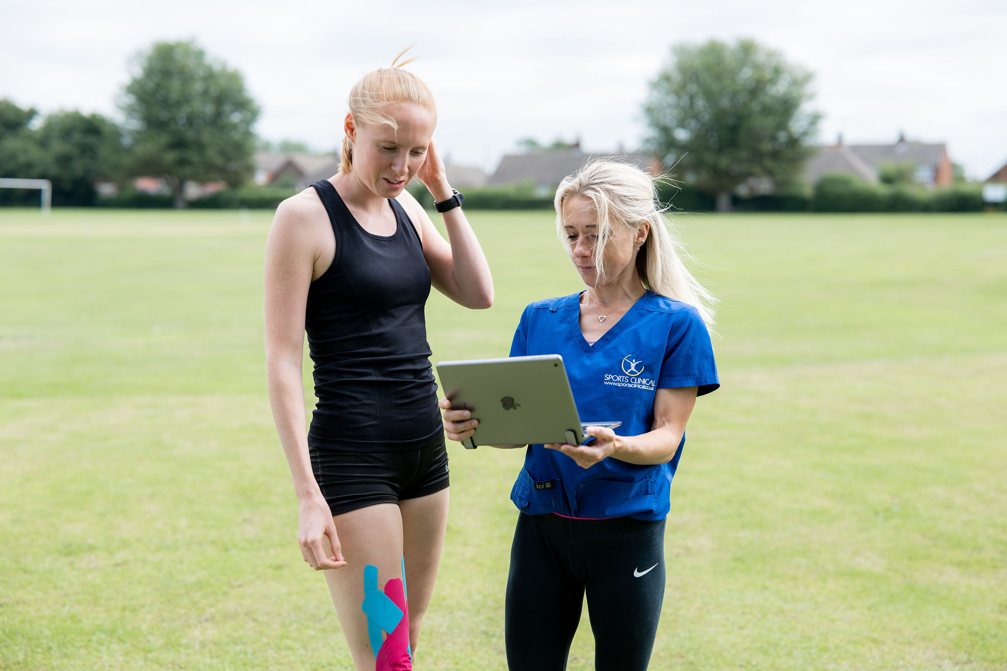 Reviewing progress outdoors with SPORTS CLINICAL