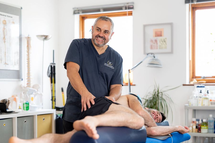 Dean Haspey treating a patient at SPORTS CLINICAL