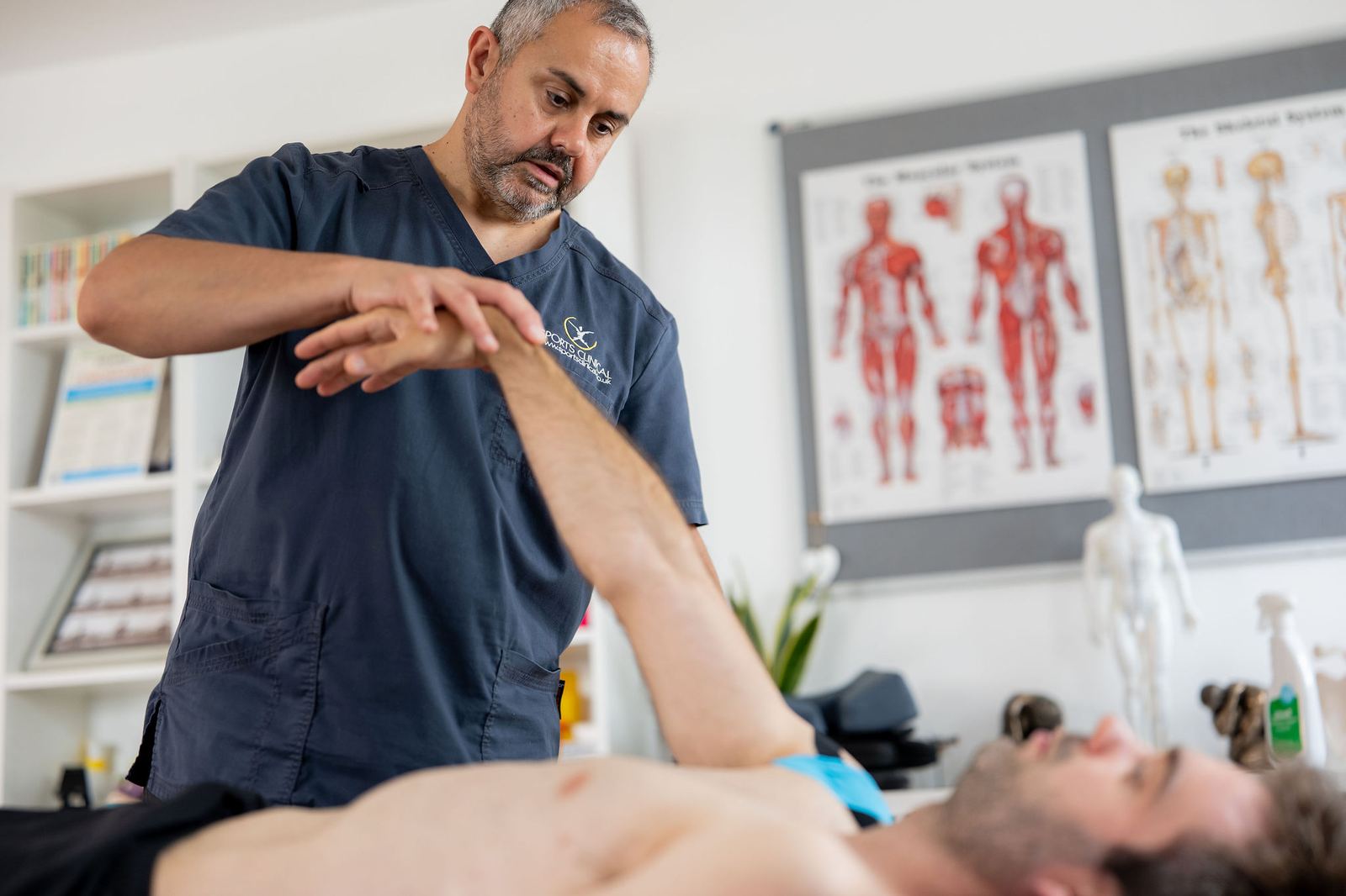 Dean Haspey assessing a patient at SPORTS CLINICAL
